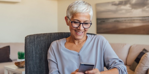 Senior woman looking at her smartphone